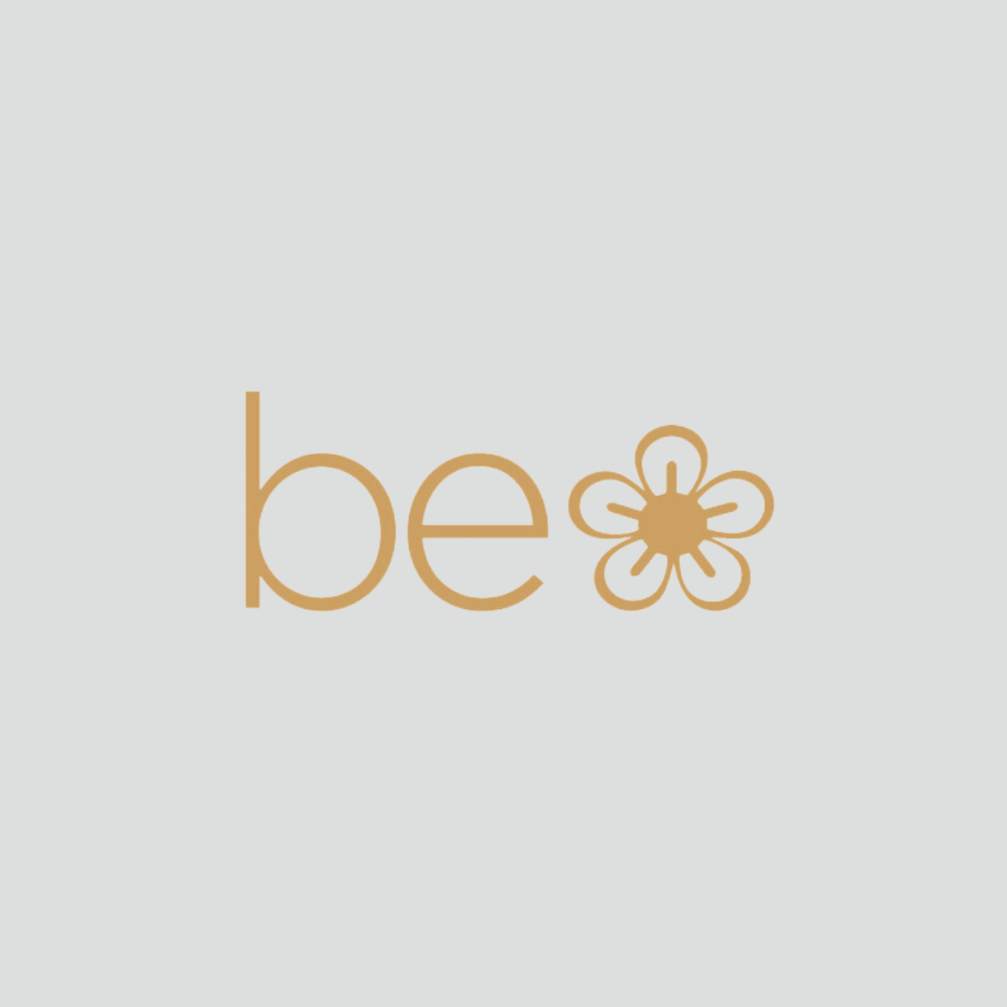 Balanced Essentials logo featuring 'be' with a flower design, symbolizing natural beauty and wellness.