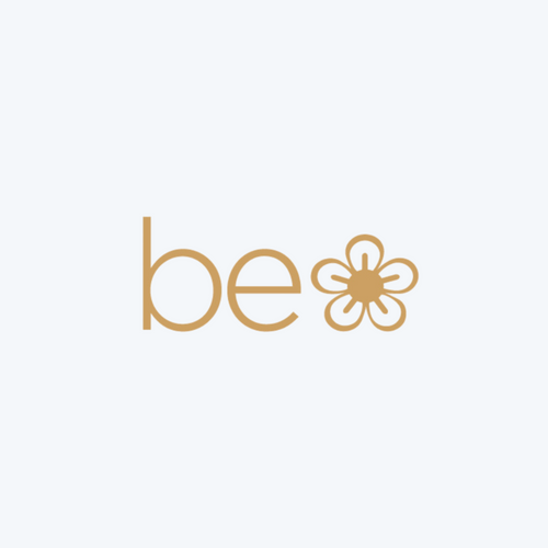 be logo featuring the letter 'b' and a flower design, representing natural beauty and wellness.